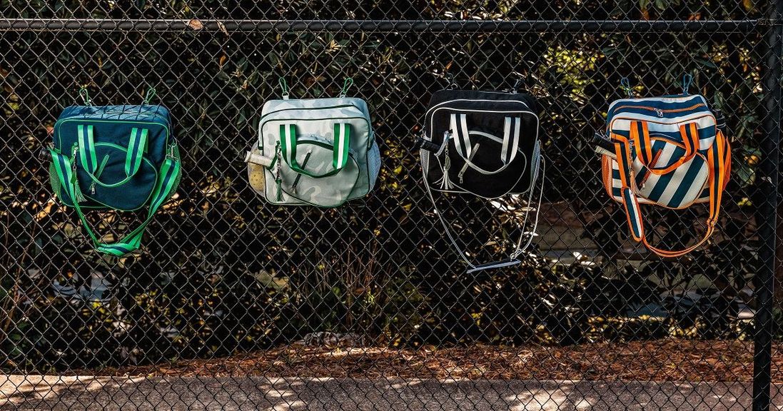
                                        The Fresh Pickle Lola Bags hook onto the fence for convenient, on-court storage.
                                    