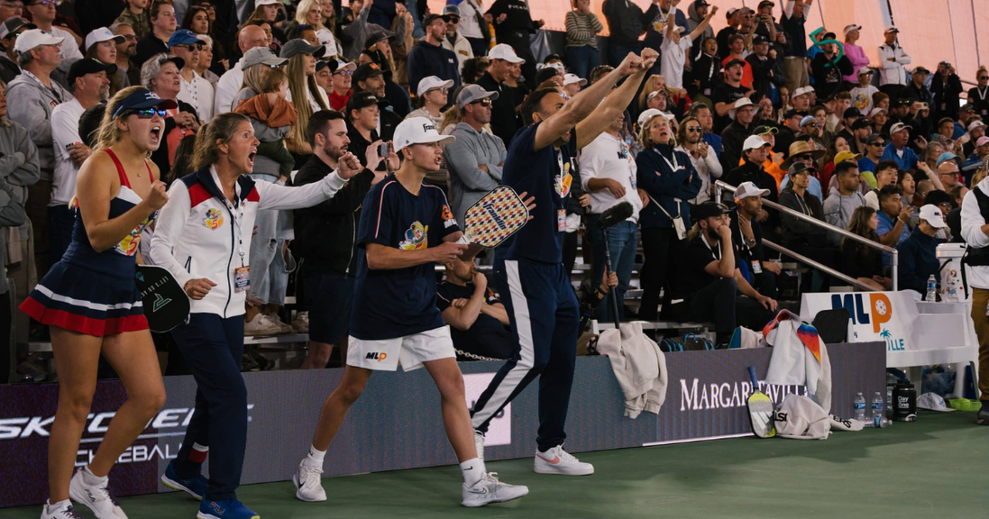 
                                        Major League Pickleball players celebrate after a point.
                                    