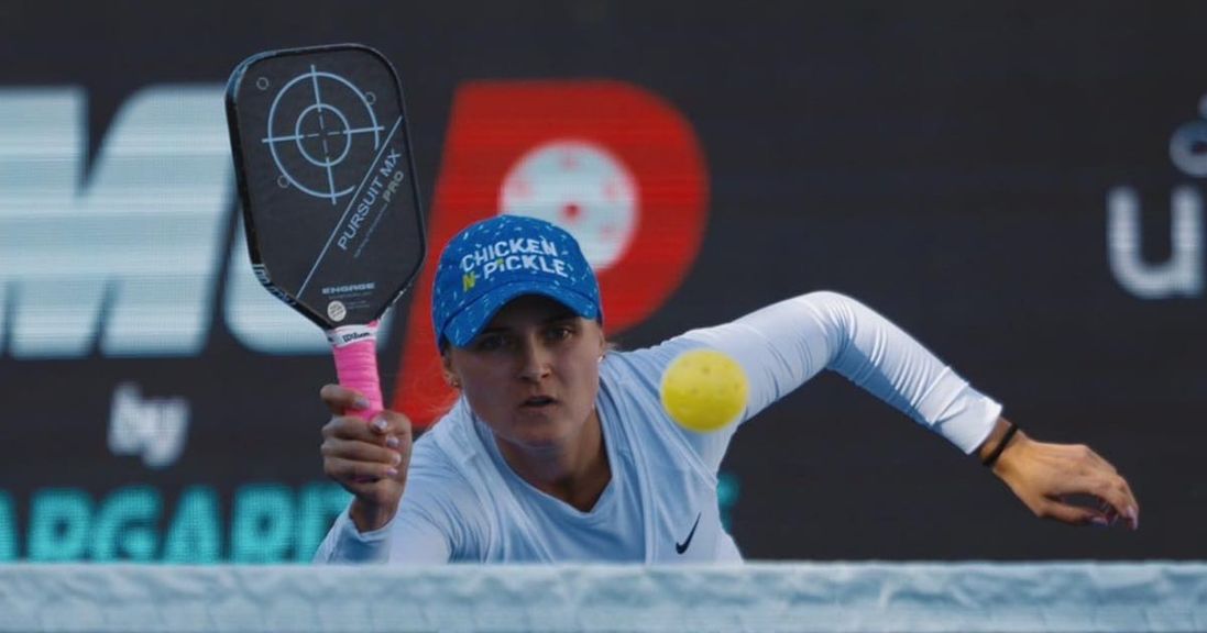 
                                        A pickleball pro prepares to crush ball that was popped up.
                                    