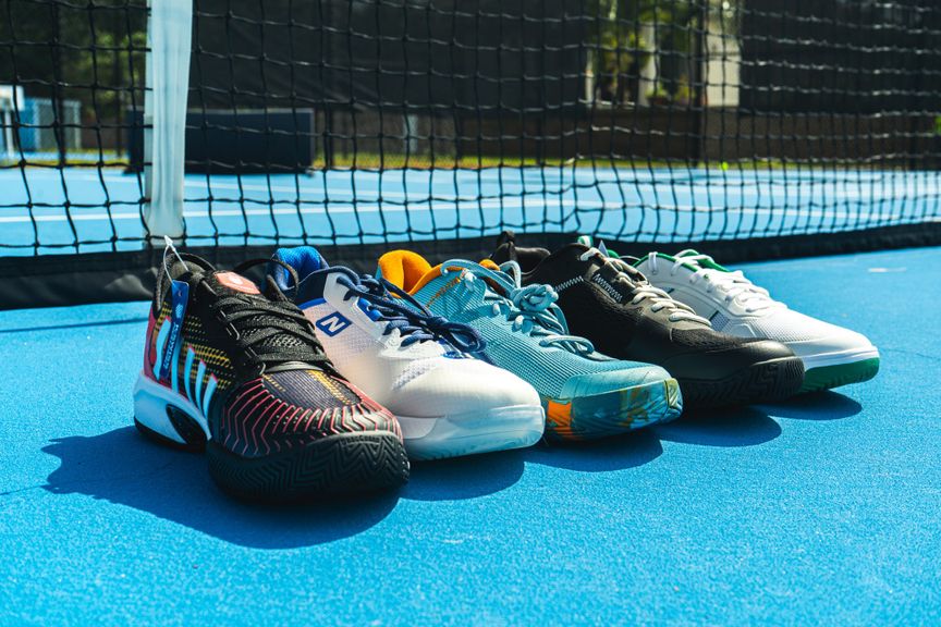 
                                        Pickleball Shoes Laying Next to Each Other on a Pickleball Court
                                    