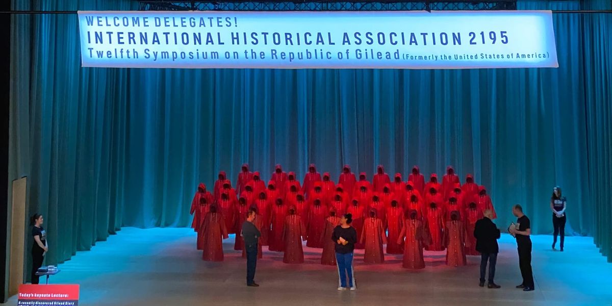 Opening scene of The Handmaid's Tale at the English National Opera in London, with the red Handmaids' hoods