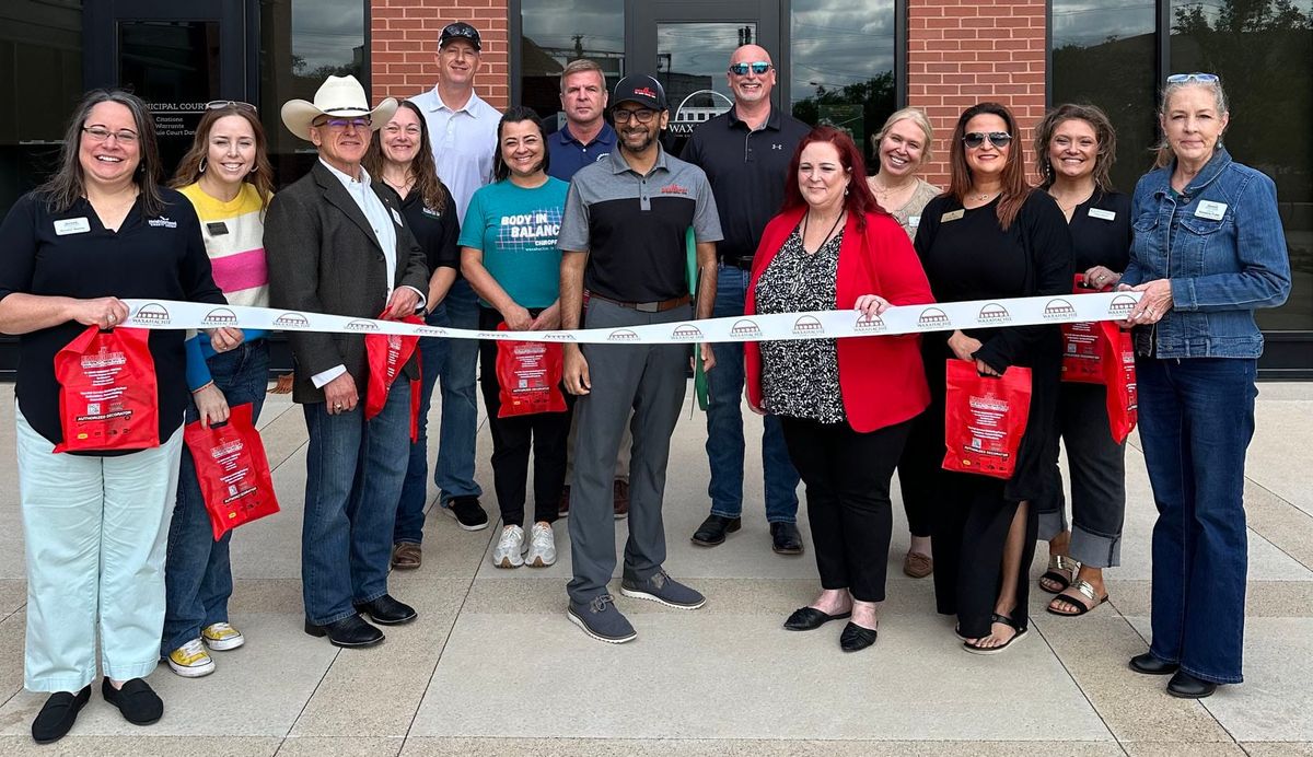 JZ Embroidery and Printing ribbon cutting held
