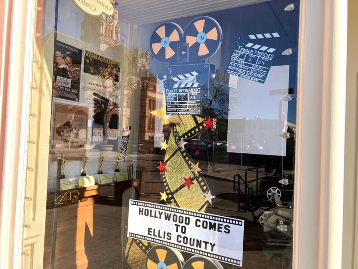 A photo of the window exhibit, "Hollywood Comes to Ellis County" at the Ellis County Museum in downtown Waxahachie.