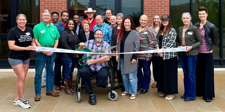 Photo of a ribbon cutting.