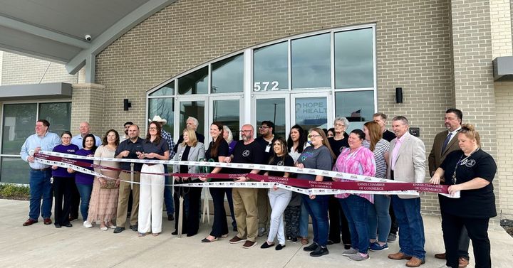 A photo of the ribbon cutting for Hope Health's new facility in Waxahachie.