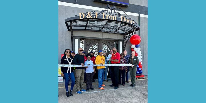 Ribbon cutting photo for D&J Builders Surplus.