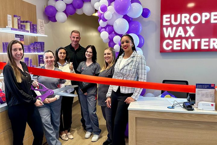 Photo of a ribbon cutting.