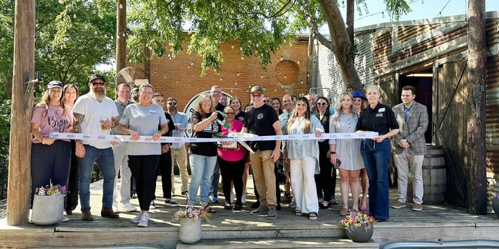 Photo of a ribbon cutting.