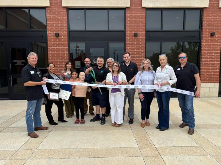 Photo of a ribbon cutting.