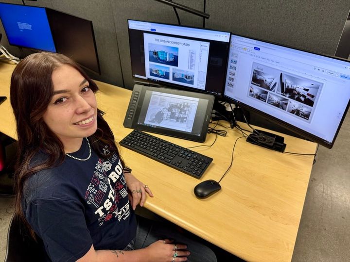 A student sitting at a computer.
