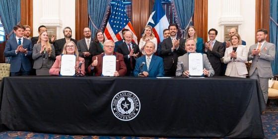 Photo of a bill-signing ceremony.