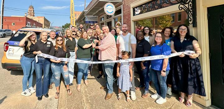 Photo of a ribbon cutting.