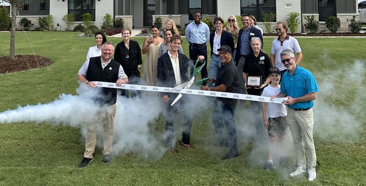 Photo of a ribbon cutting.