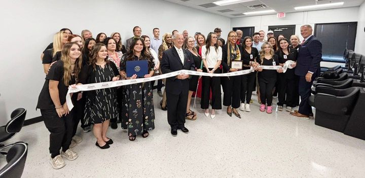 Photo of a ribbon cutting.