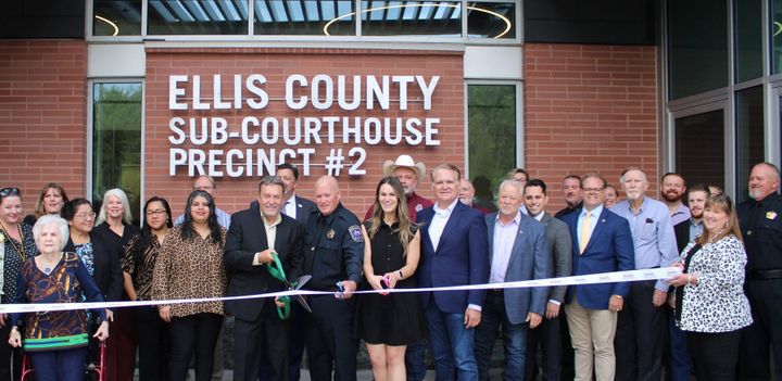 Photo of a ribbon cutting.