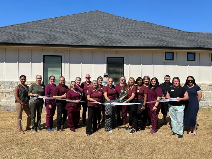 Photo of a ribbon cutting.