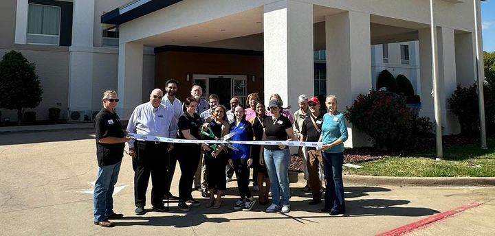 Photo of a ribbon cutting.