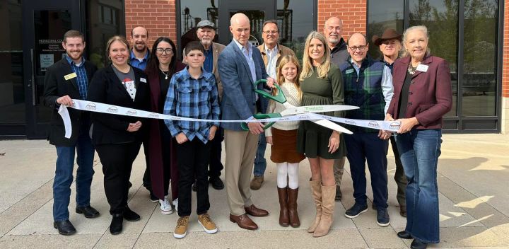 Photo of a ribbon cutting.