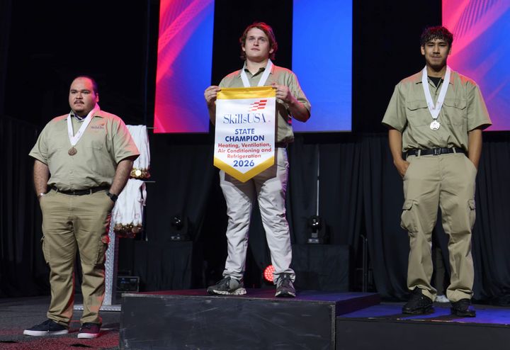 Medal winners are shown on a podium.