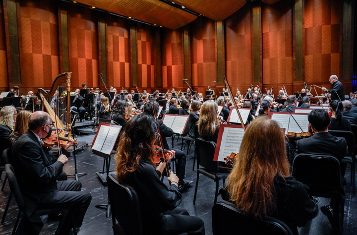 A photo of a orchestra in concert.