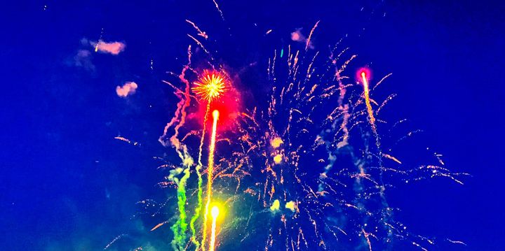 Fireworks display their different colors against the sky.