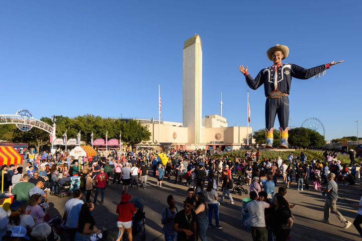 Big Tex amidst a crowd of State Fair of Texas patrons.