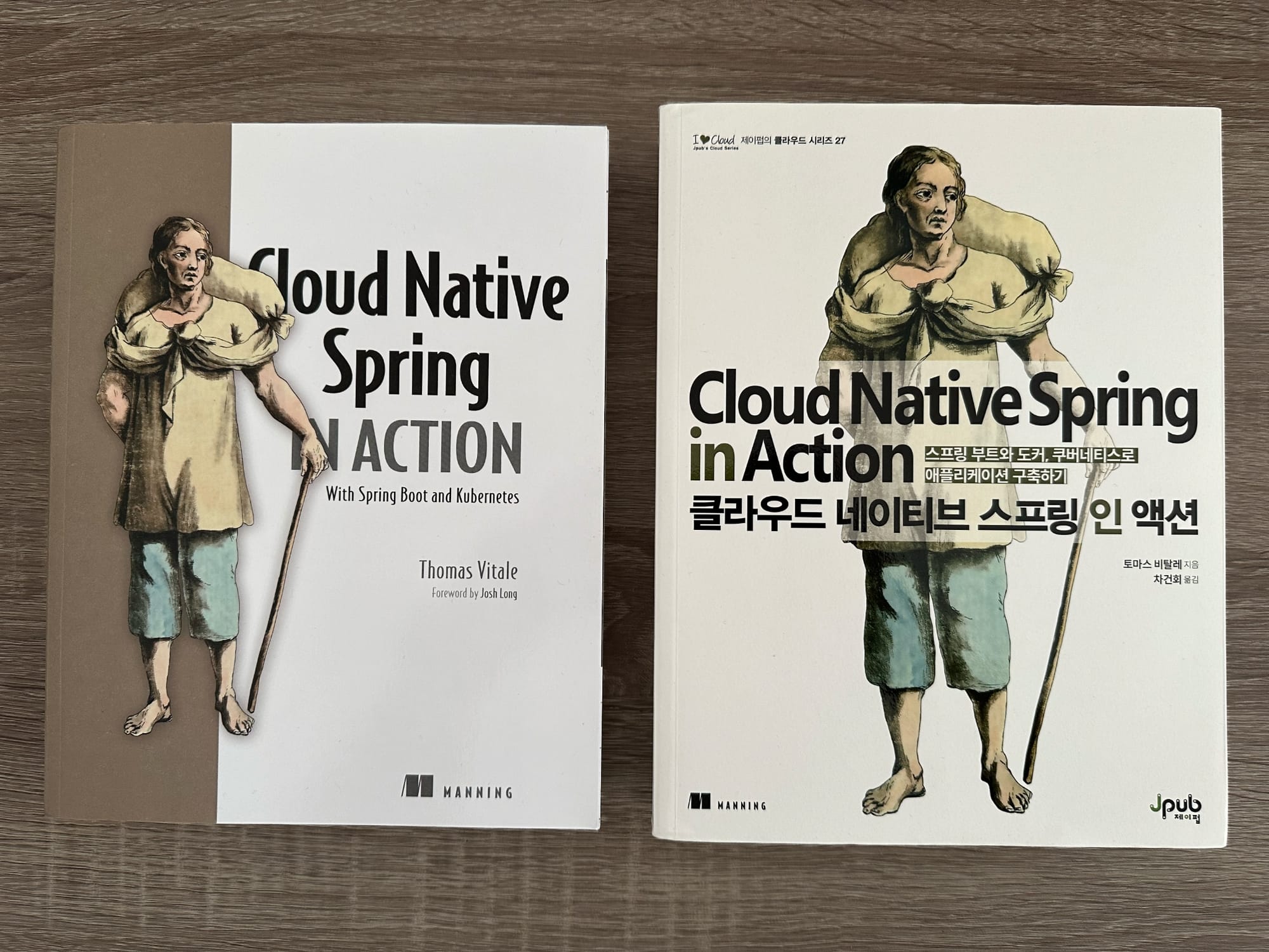 On the left, a copy of the book "Cloud Native Spring in Action - With Spring Boot and Kubernetes" by Thomas Vitale. On the right, the Korean translation.