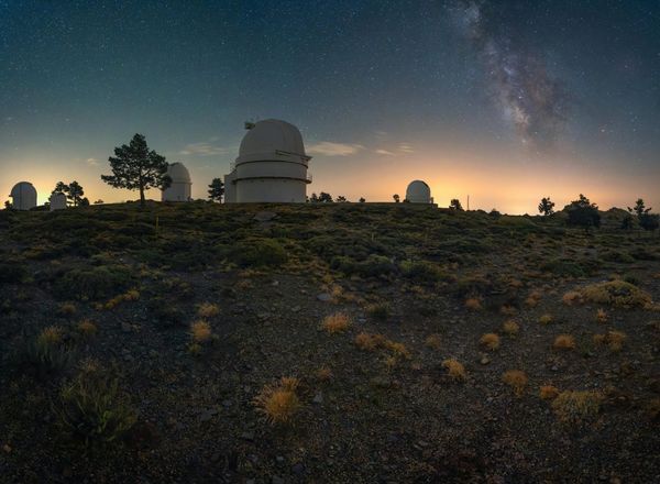 Breathtaking view of observatories beneath a starry night sky, ideal for astrophotography enthusiasts - Photo by Horacio Lander