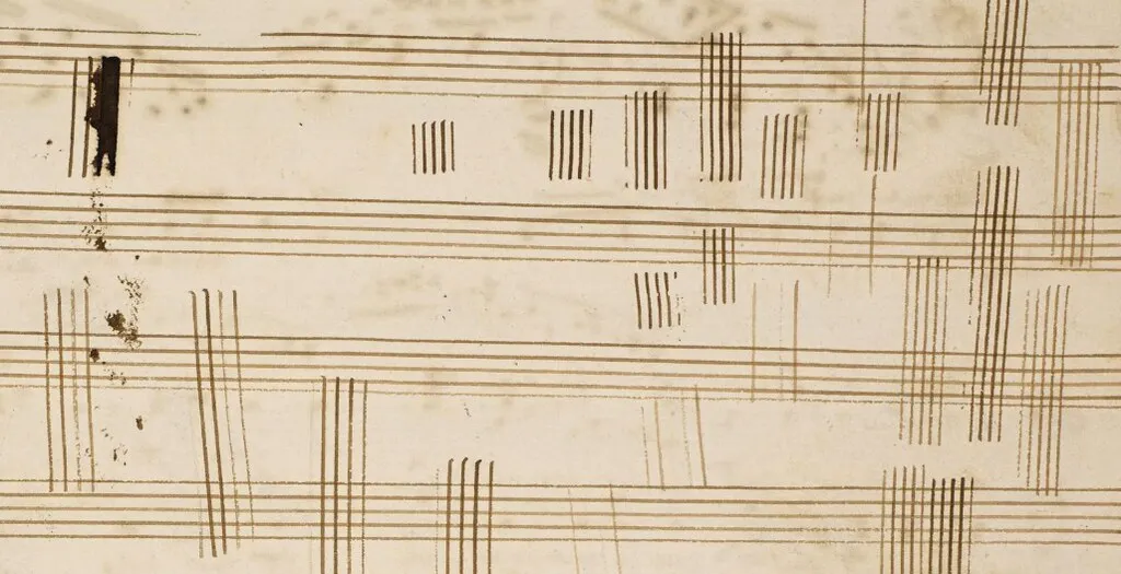 Aged paper with rows of hand-drawn vertical tally marks on ruled lines
