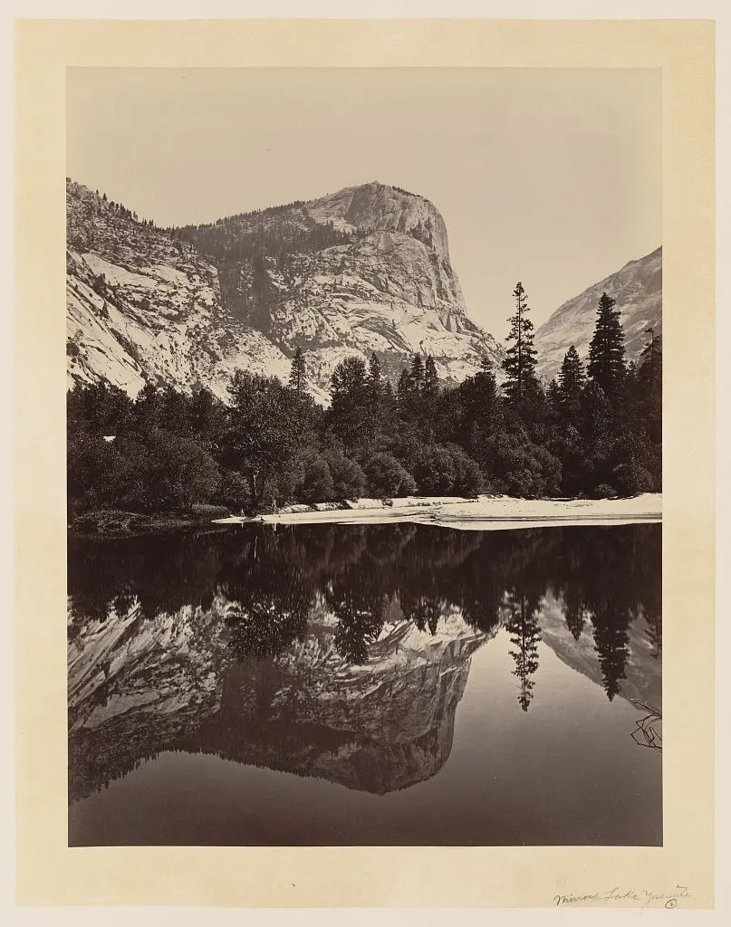Nineteenth-century photograph of a mountain reflected in a still lake