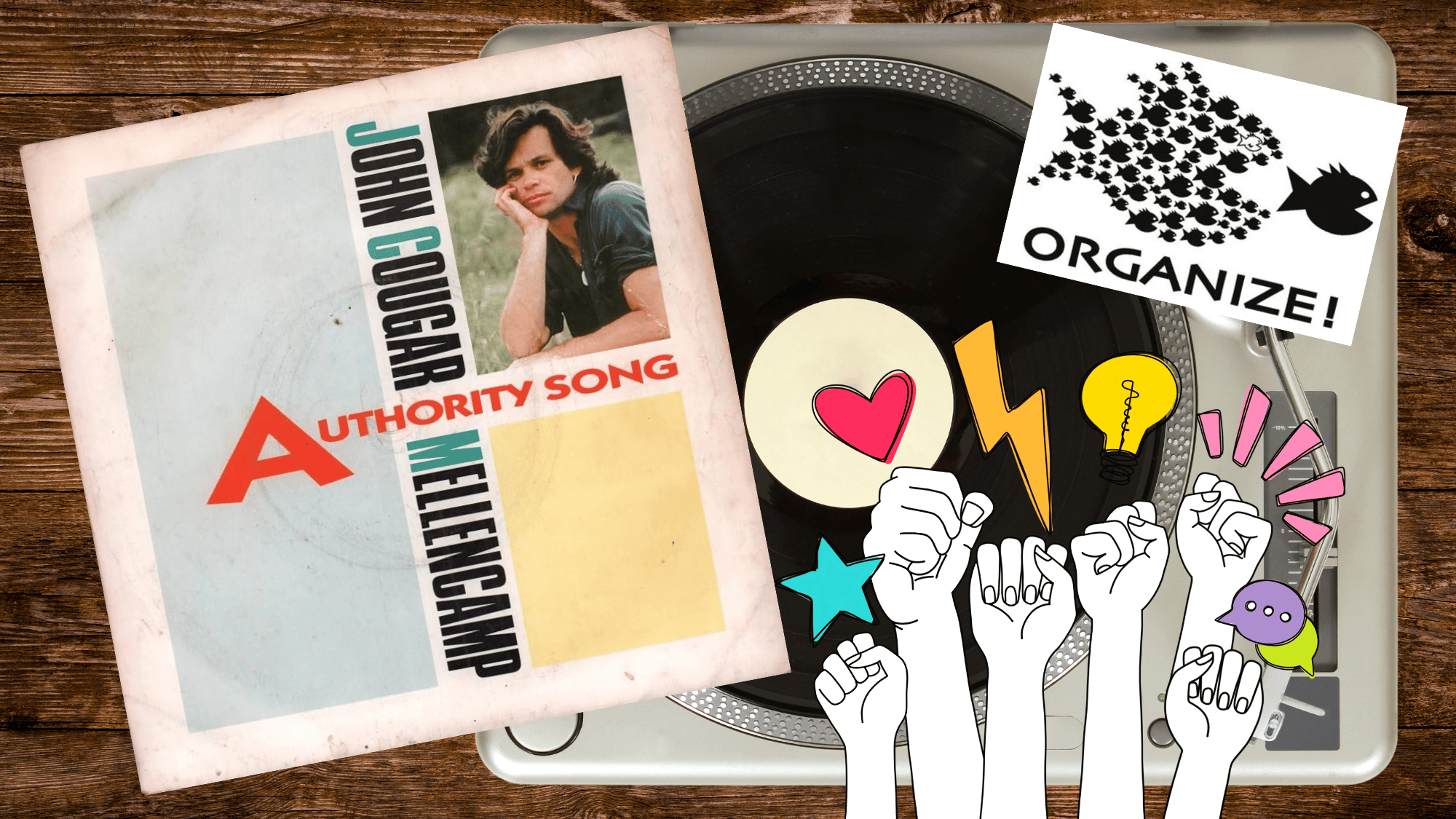 A table with a record player and the John Mellencamp album Authority Song with an organize sticker and fists up