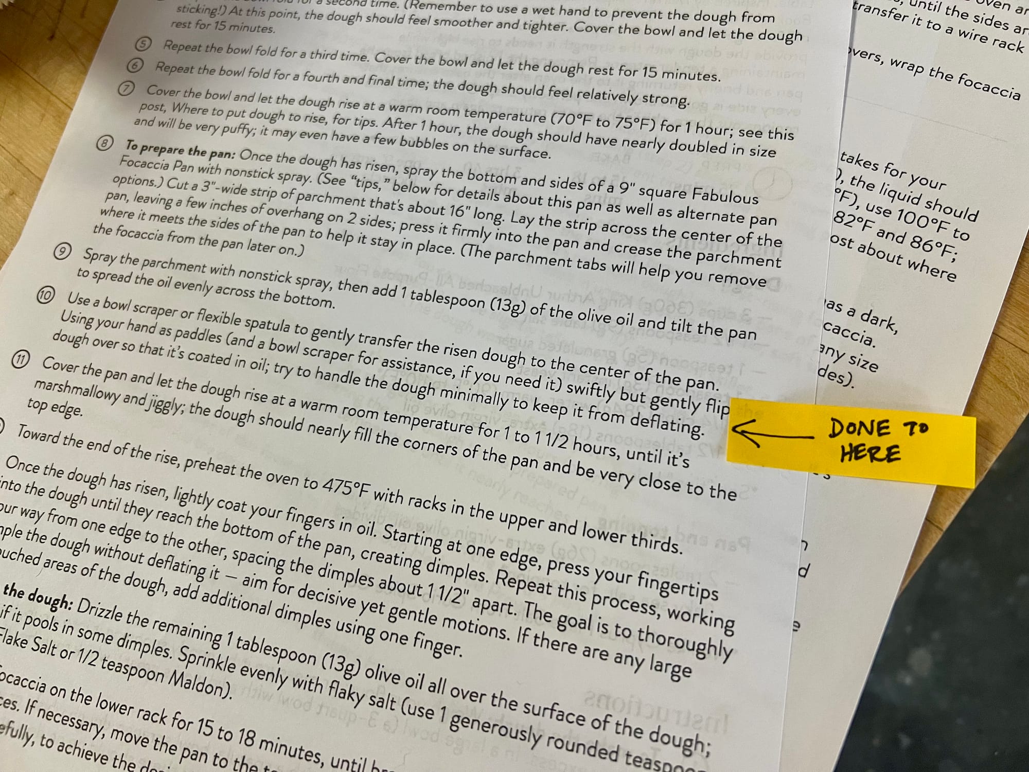 A printed recipe has a yellow post-it flag on the margin, it has an arrow and says "done to here."