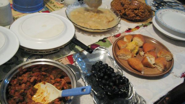 A table laid for iftar, the meal that breaks the Ramadan fast, with bread, stews, olives and pastries
