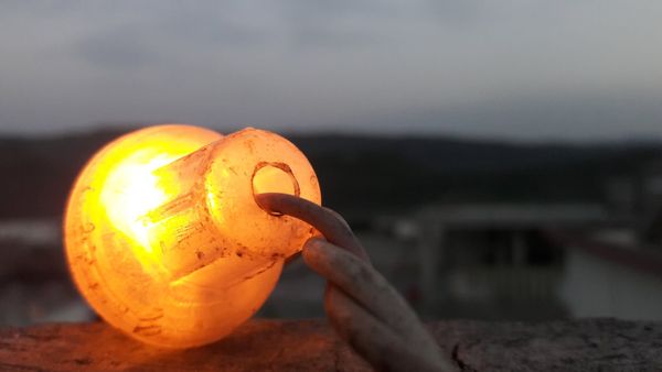 A lamp lit at dusk for Shab-e-Barāt