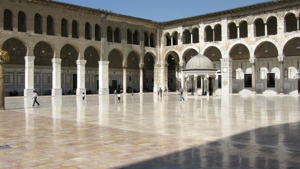 The marble courtyard and arcades of the Umayyad Mosque in Damascus