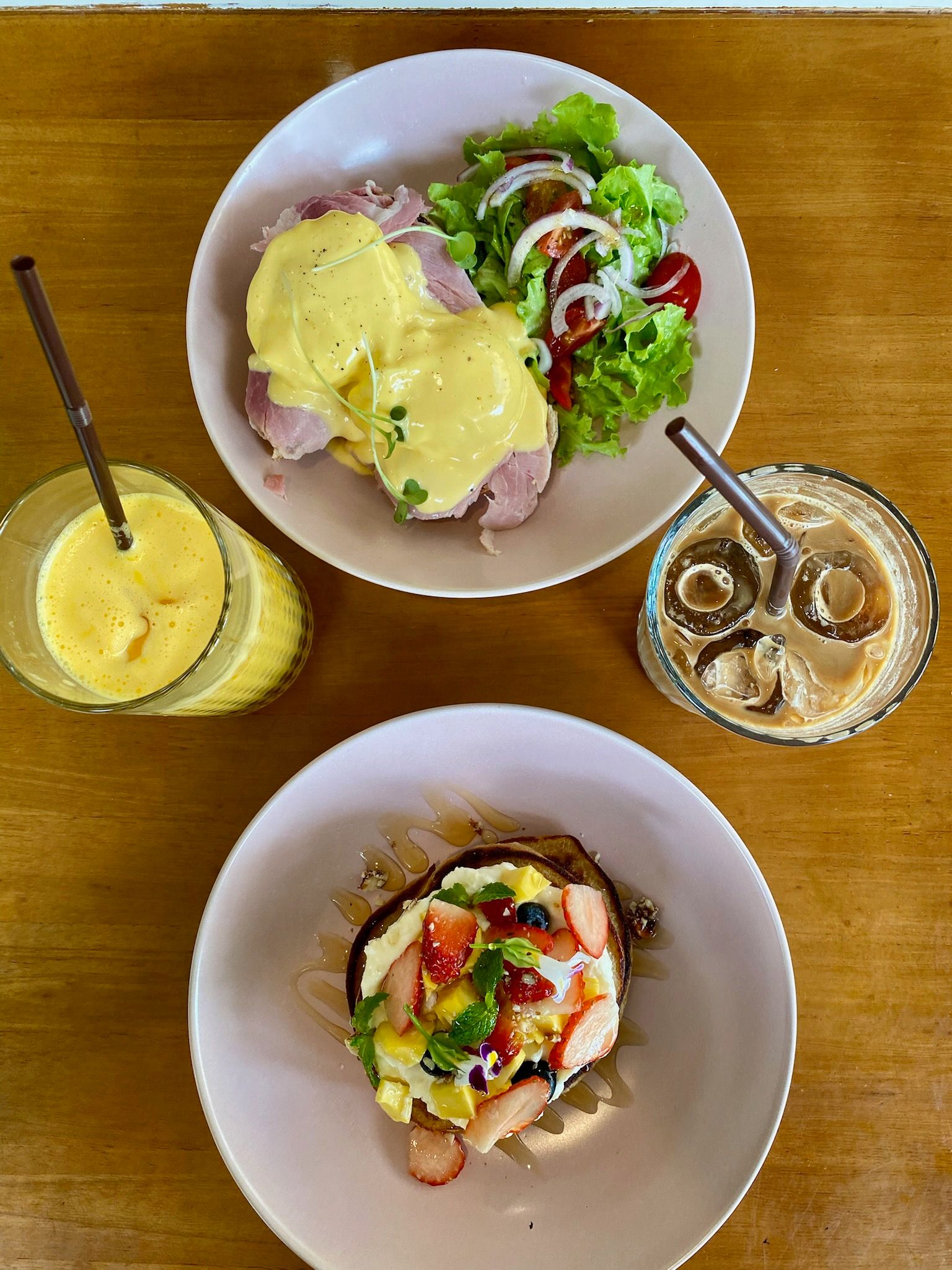 Eggs benedict and pancakes at a cafe