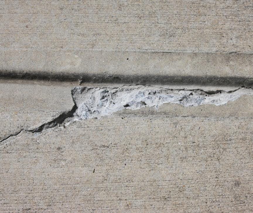 Concrete spalling caused by the improper application of rock salt