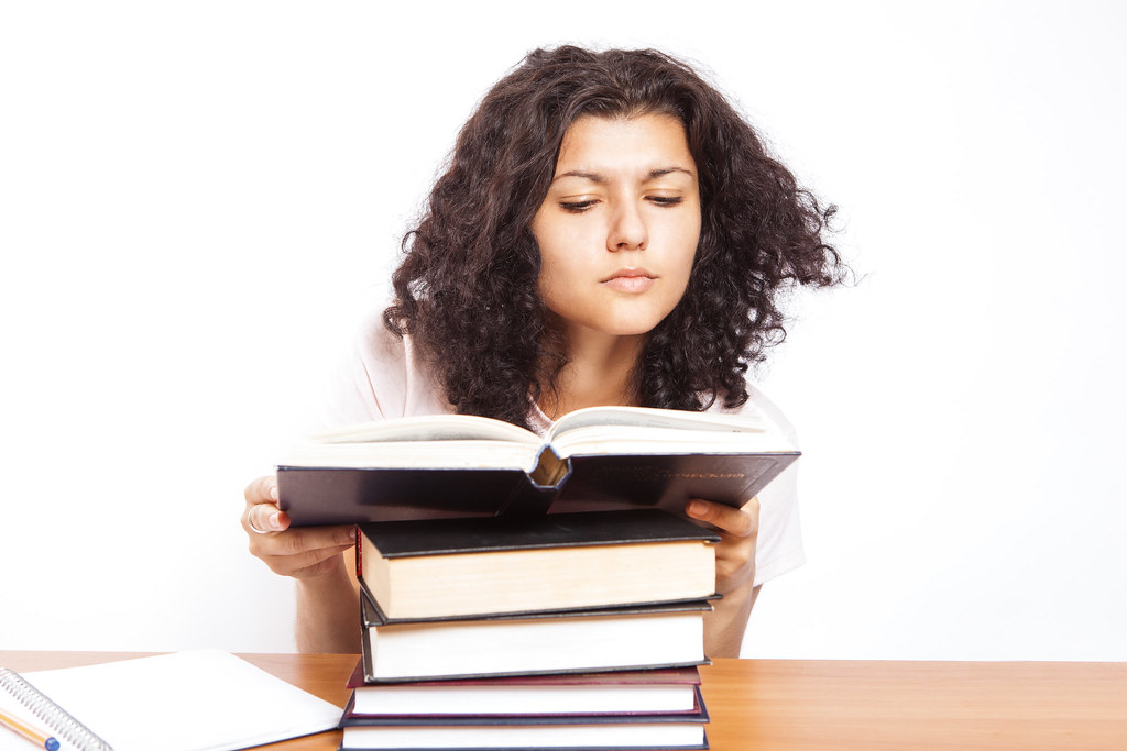 student reading a book - Personal Statement for College