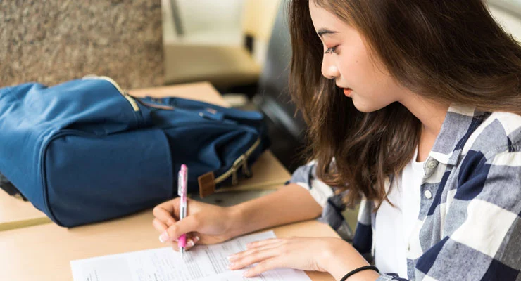 student writing - College App