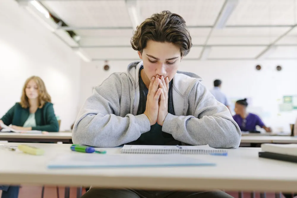 student in a classroom - UChicago Supplemental Essays