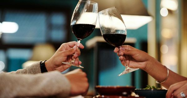 Couple toasting with wine glasses at a restaurant