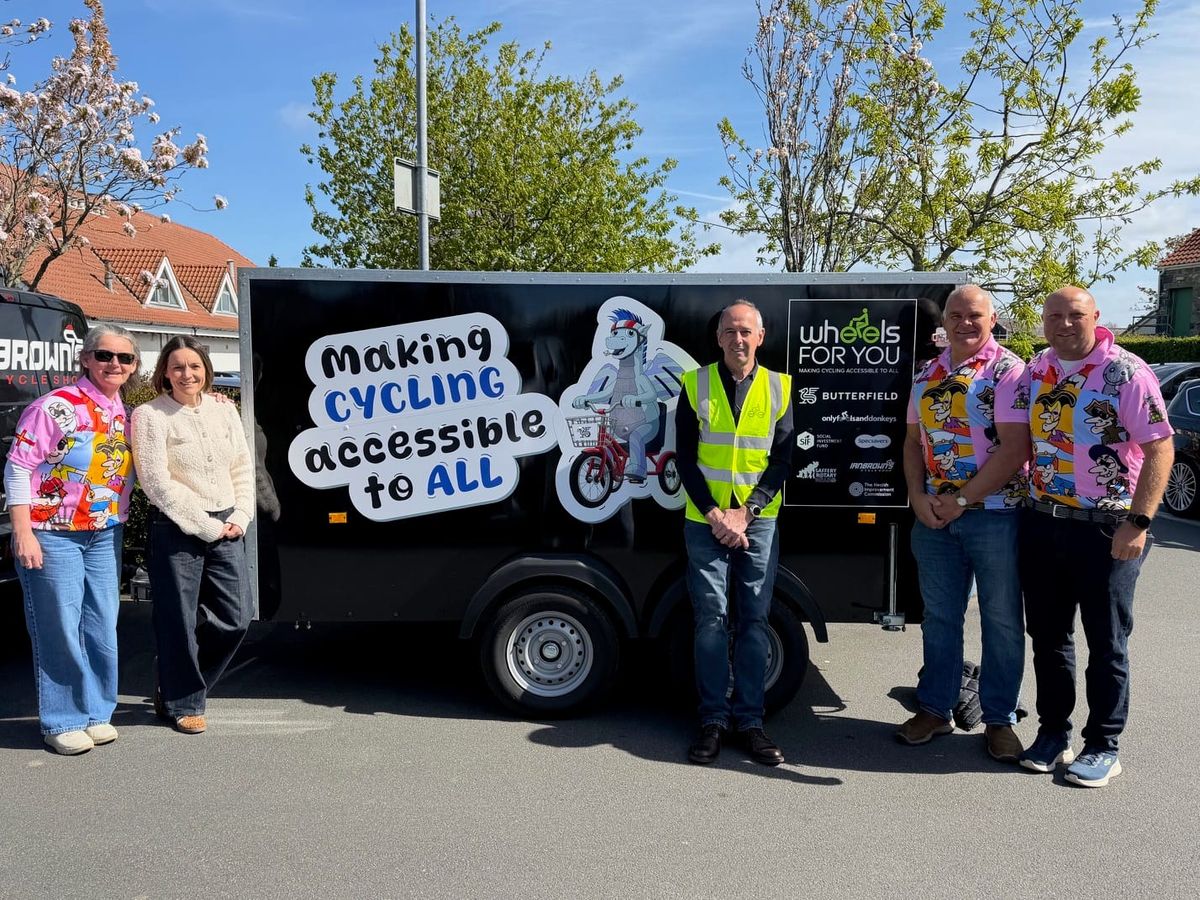 Charity receives bike trailer donation to expand cycling access for disabled users