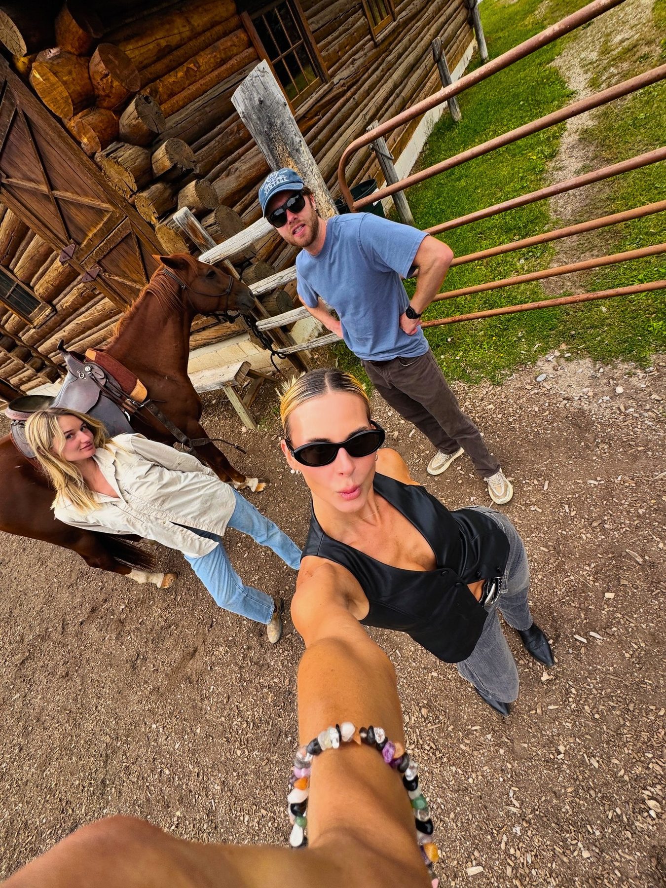From Kara Hobby’s Wilson Mom summer: friends taking a wide-angle selfie at a ranch corral
