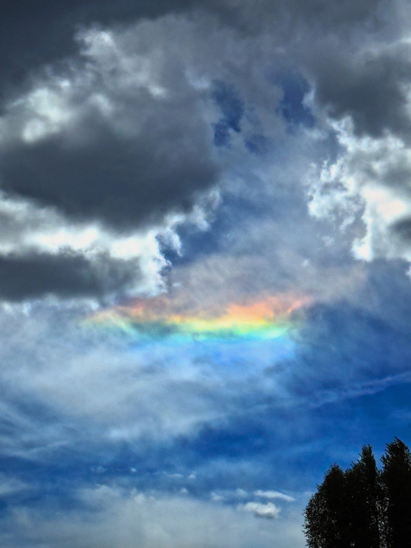 From Kara Hobby’s Wilson Mom summer: rainbow light in a stormy cloud