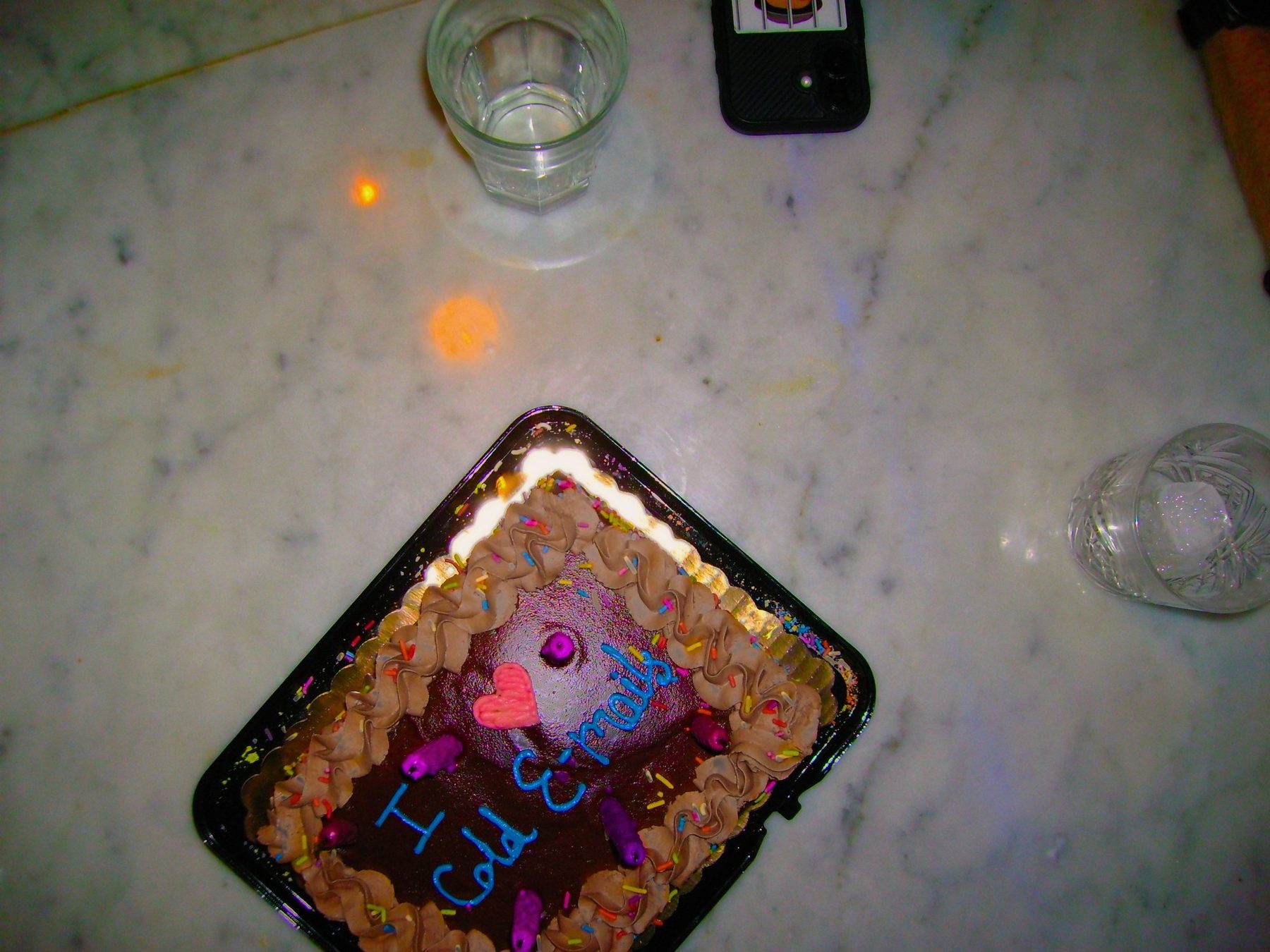 From Kara Hobby’s Wilson Mom summer: chocolate cake with blue icing on a marble table