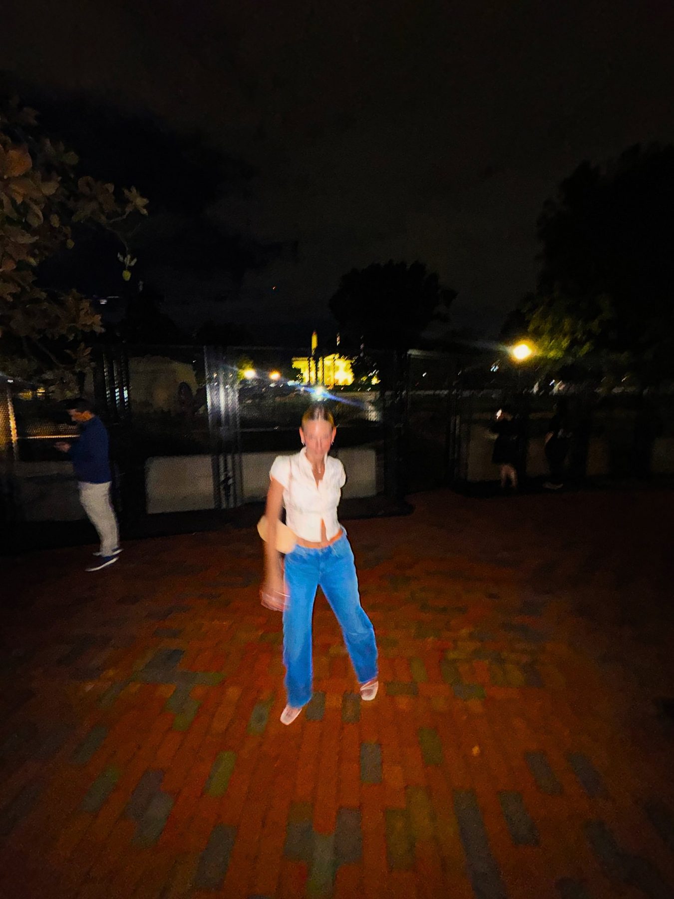 From Kara Hobby’s Wilson Mom summer: woman on a brick plaza at night