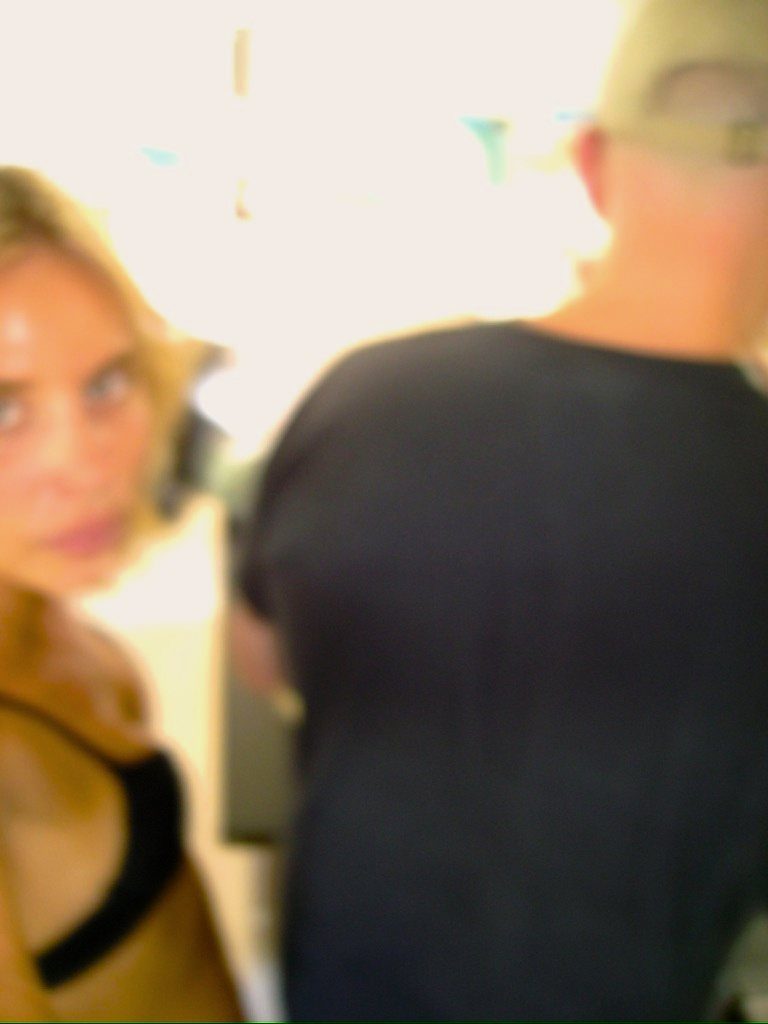 From Kara Hobby’s Wilson Mom summer: blurry glance over the shoulder at a party