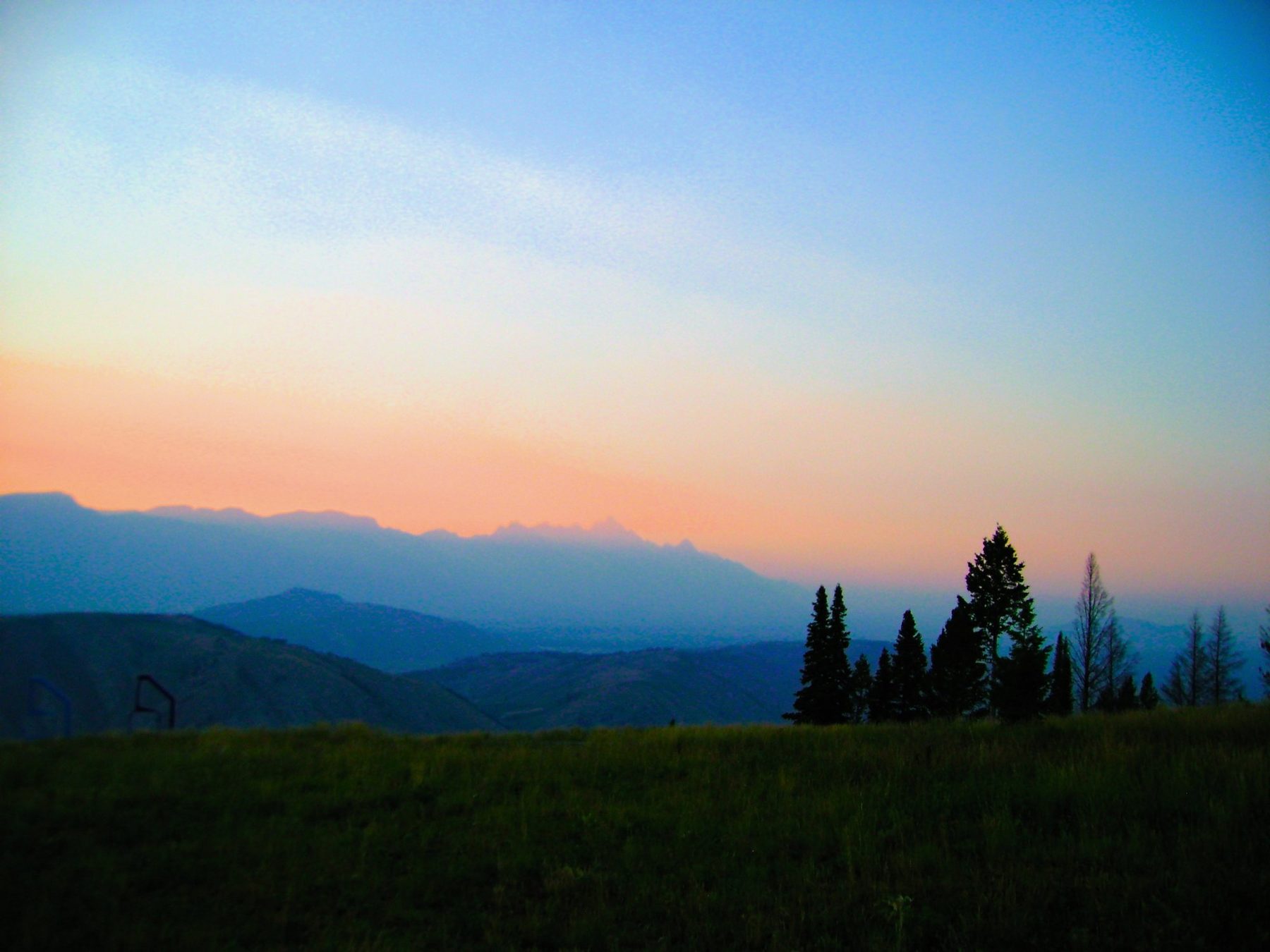 From Kara Hobby’s Wilson Mom summer: pink and blue dusk over the Teton range