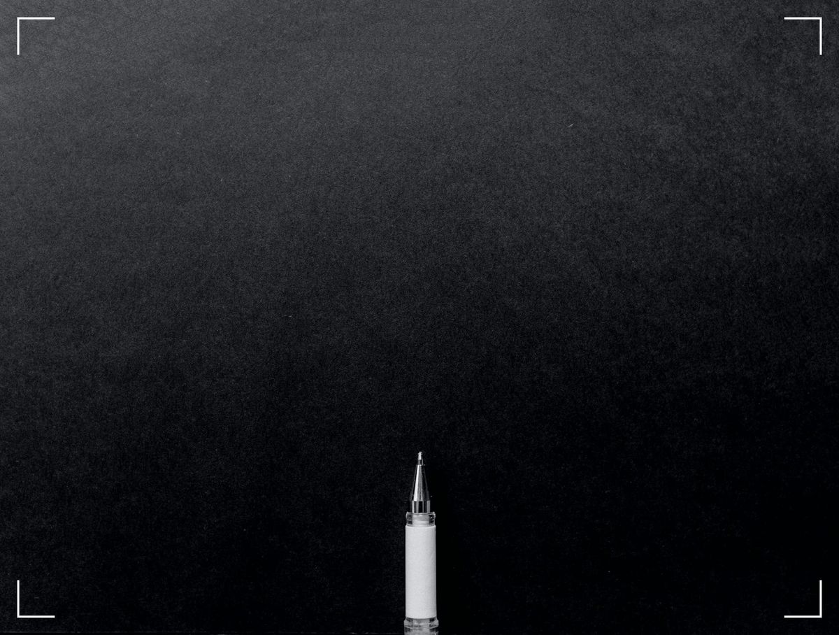A pencil on a black background.