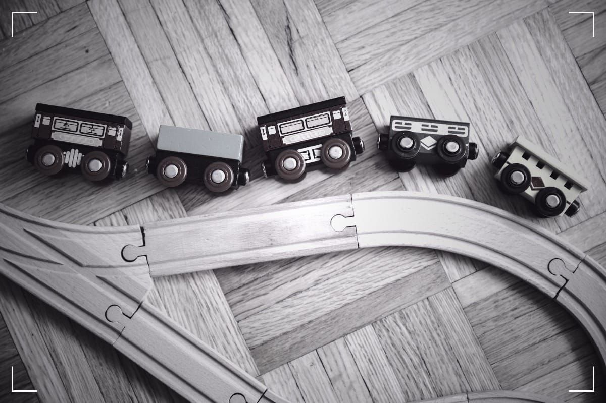 A wooden, toy train simmulating an accident.